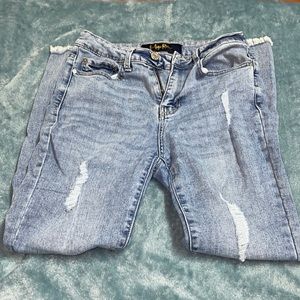 Distressed blue skinny jeans